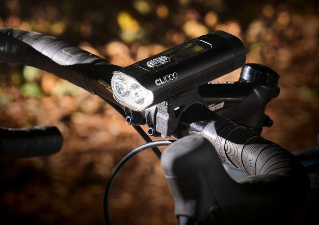 CL1000 bike front light mounted on handlebar in forest setting