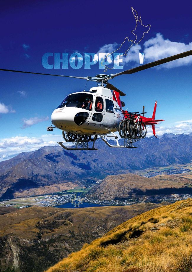 Helicopter carrying mountain bikes flying over Queenstown New Zealand