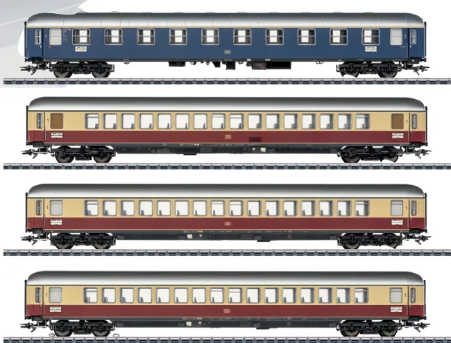 Four Märklin/Trix HO scale DB passenger coaches shown in blue, cream-red and blue-cream IVA express train liveries.